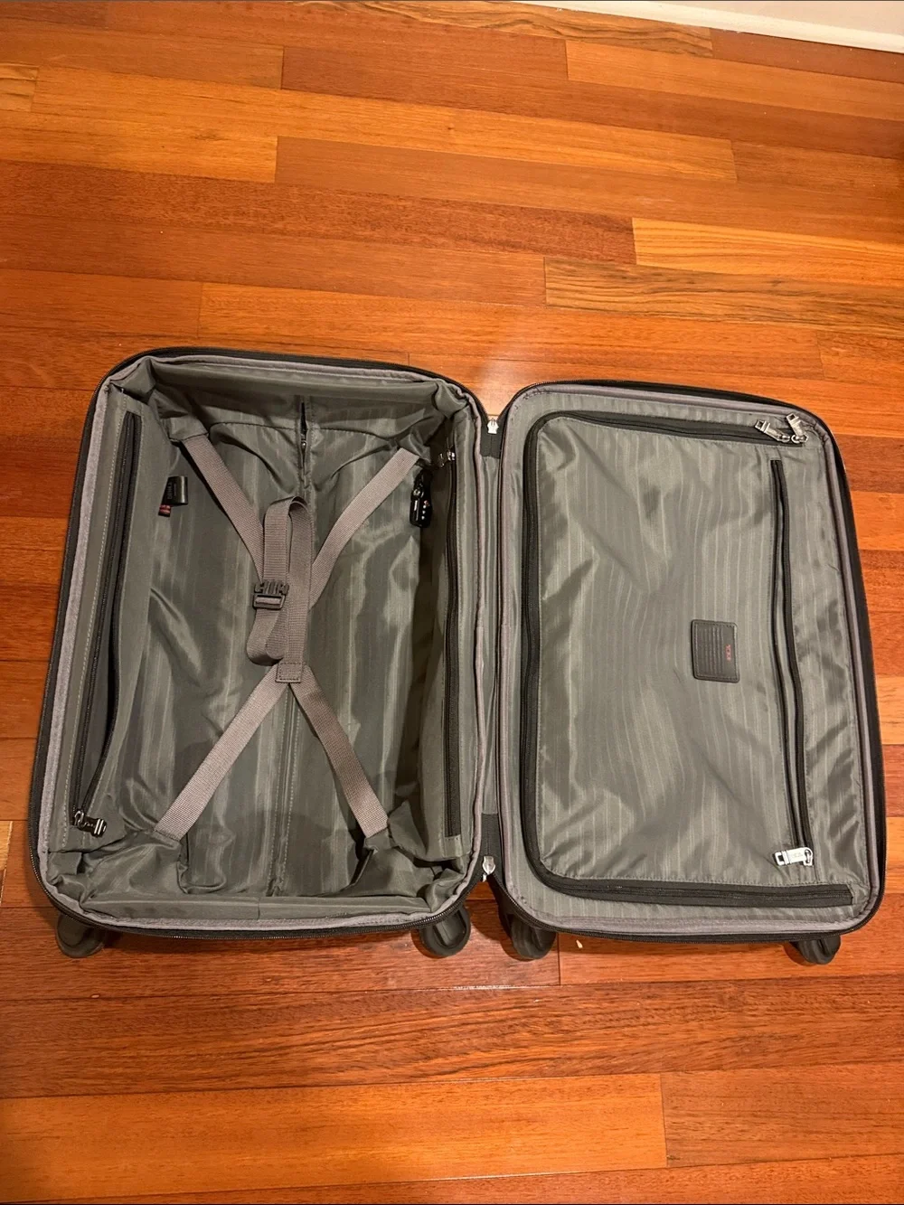 Tumi Black Carry-On Spinner with Front Zip Pocket
